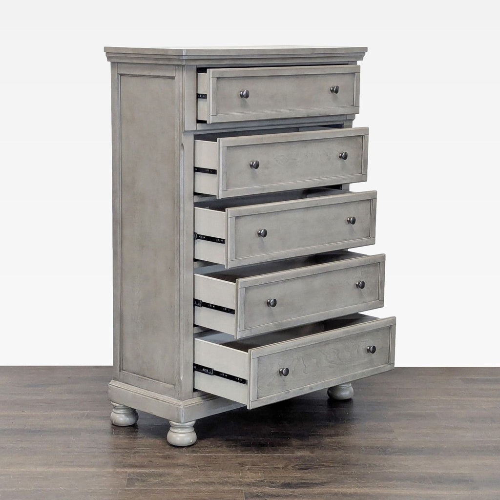 Sleek, classic dresser by Ashley Furniture in light gray, featuring five roomy drawers and sturdy wood build.