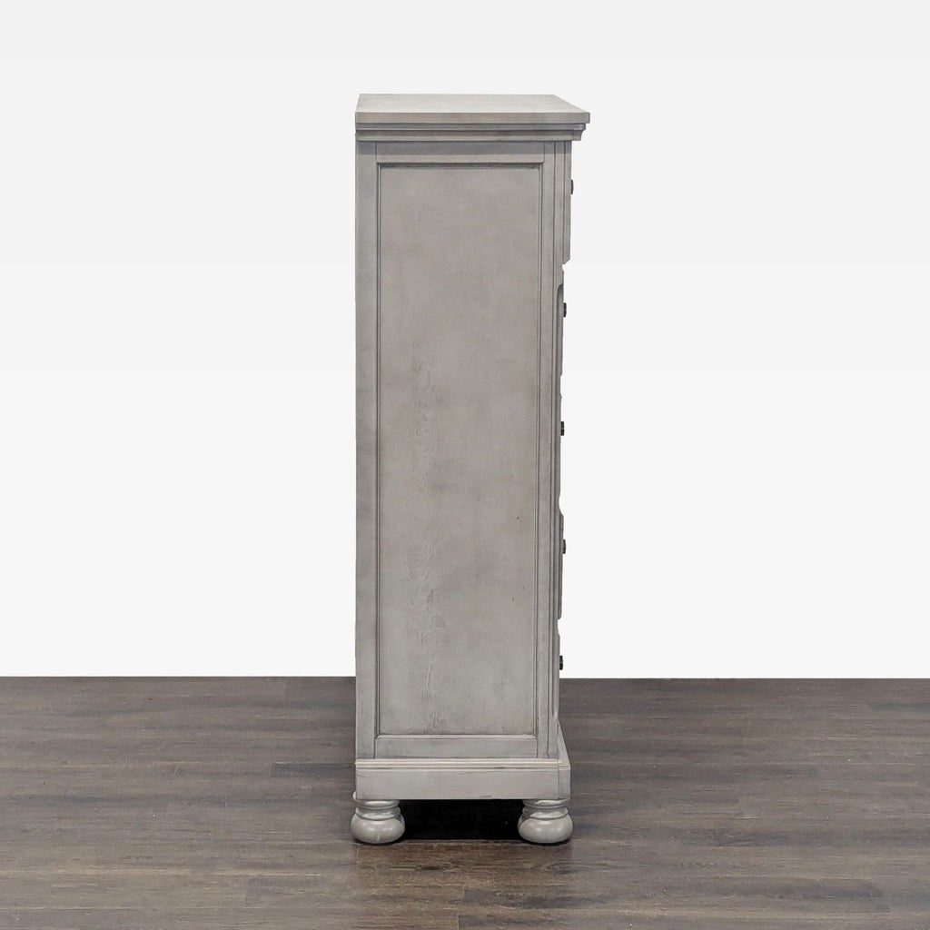 Modern light gray Ashley dresser with easy-grip knobs and spacious drawers, perfect for organizing clothes.