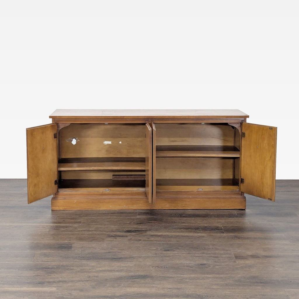 2. Open view of wooden credenza showing spacious interior shelves and storage, with some visible interior wear.