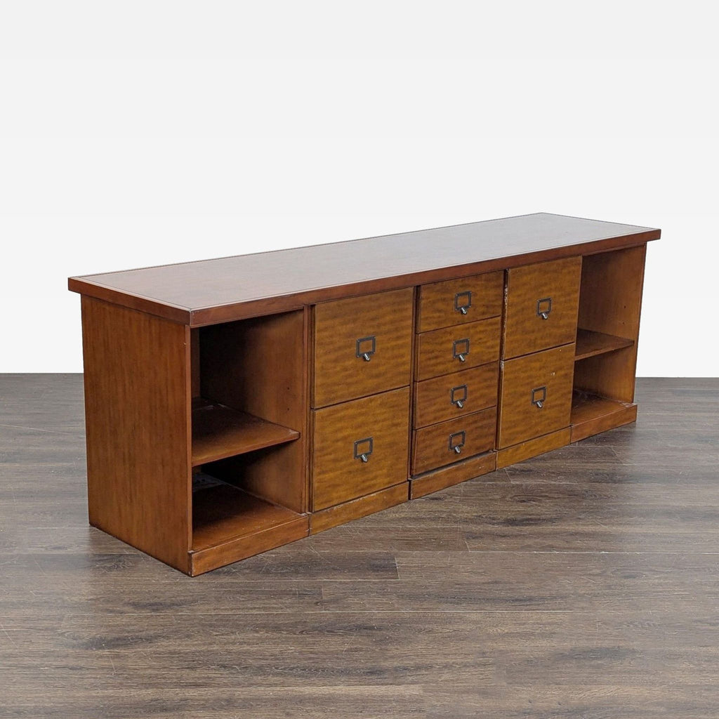 Multi-drawer Ballard Designs cabinet with end shelves, perfect for storage or electronics in any room.