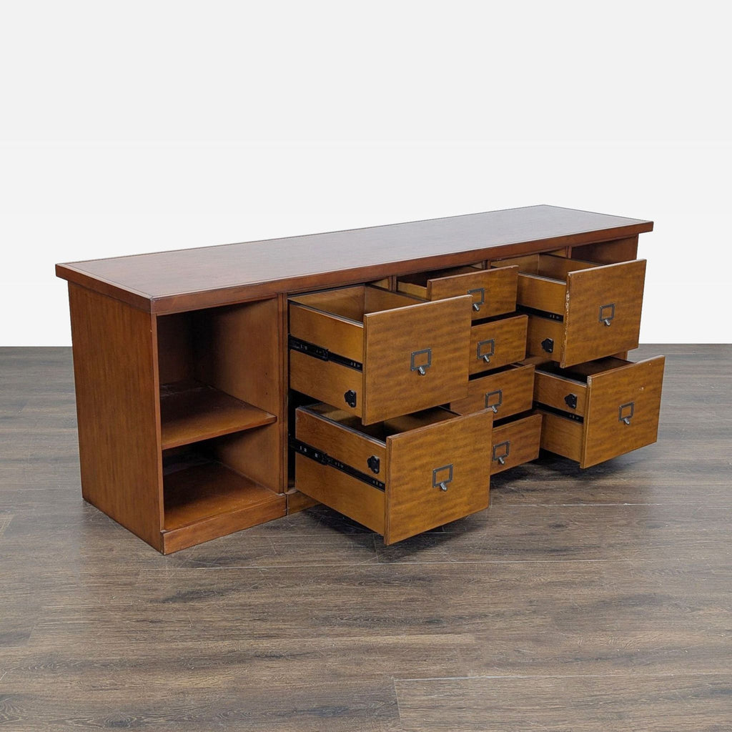 Elegant Ballard Designs cabinet featuring rich wood finish, drawers, shelving, and pre-drilled cable holes.