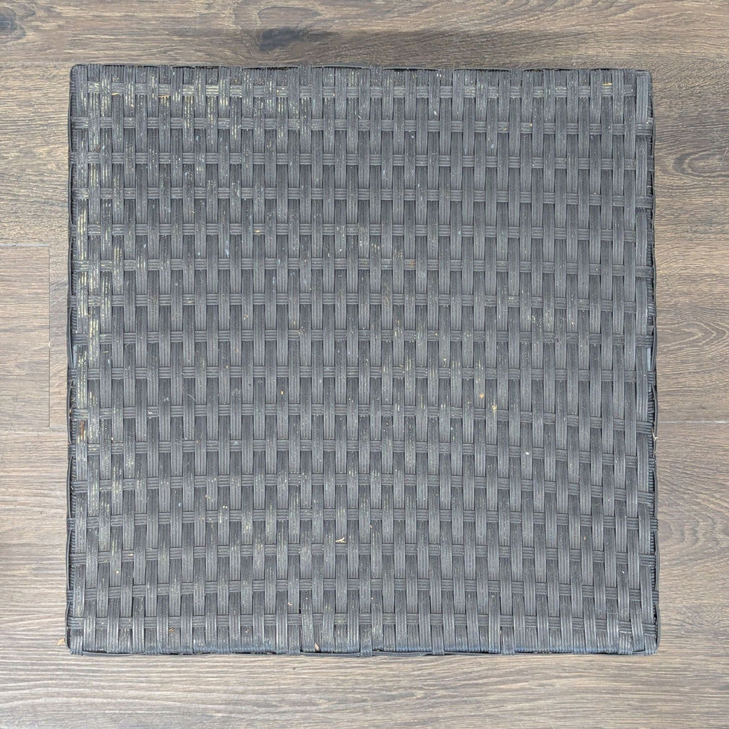 Stylish outdoor furniture set featuring two chairs and a table, made from durable black wicker.