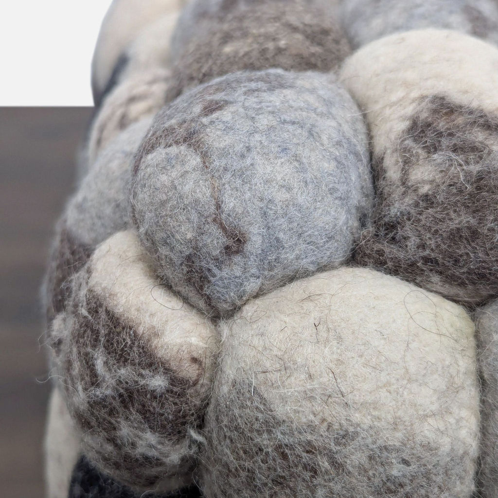Checkerboard pouf made of wool with a shag finish, perfect for benches or accent seating.