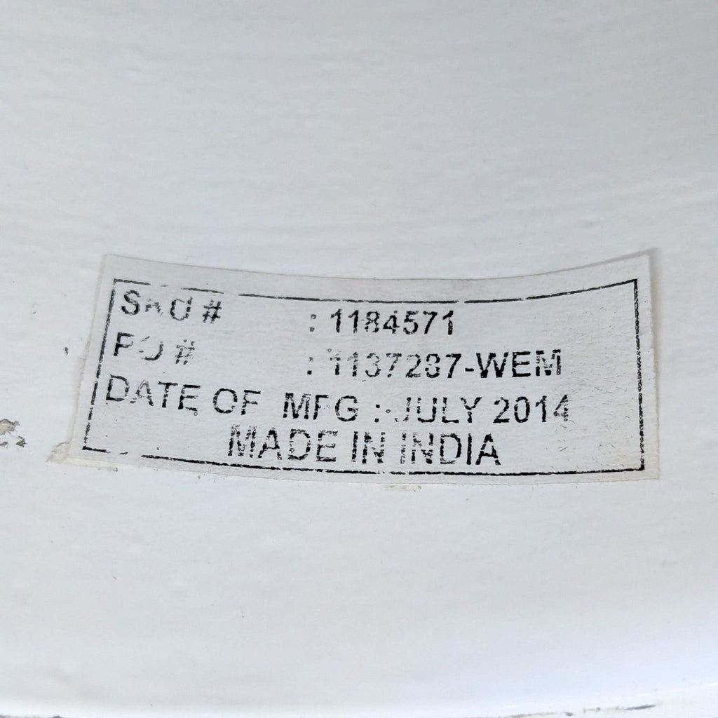 3. Manufacturer’s label on the underside of the table shows SKU, PO number, and manufacturing date in India.