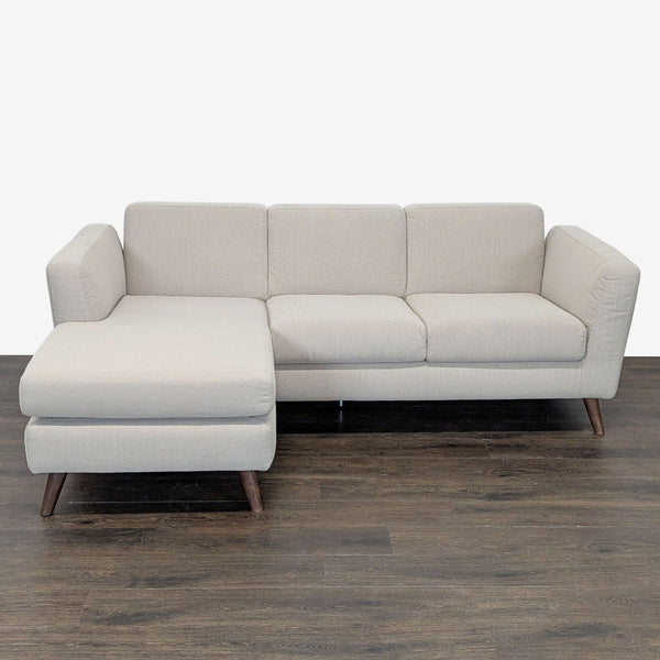 Modern beige sectional with a spacious chaise and sturdy wood legs by Moe's Home Collection.