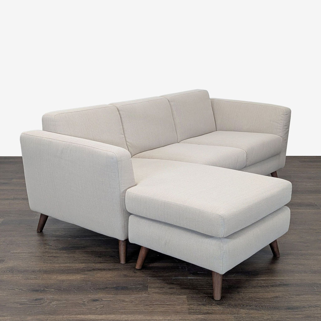 Contemporary Moe's Home Collection sectional in soft beige fabric, featuring a roomy chaise lounge.