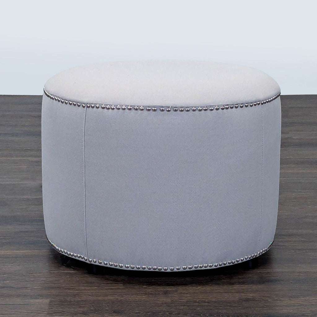 Safavieh ottoman with decorative nailhead trim, part of the Stools, Ottomans & Benches collection.  