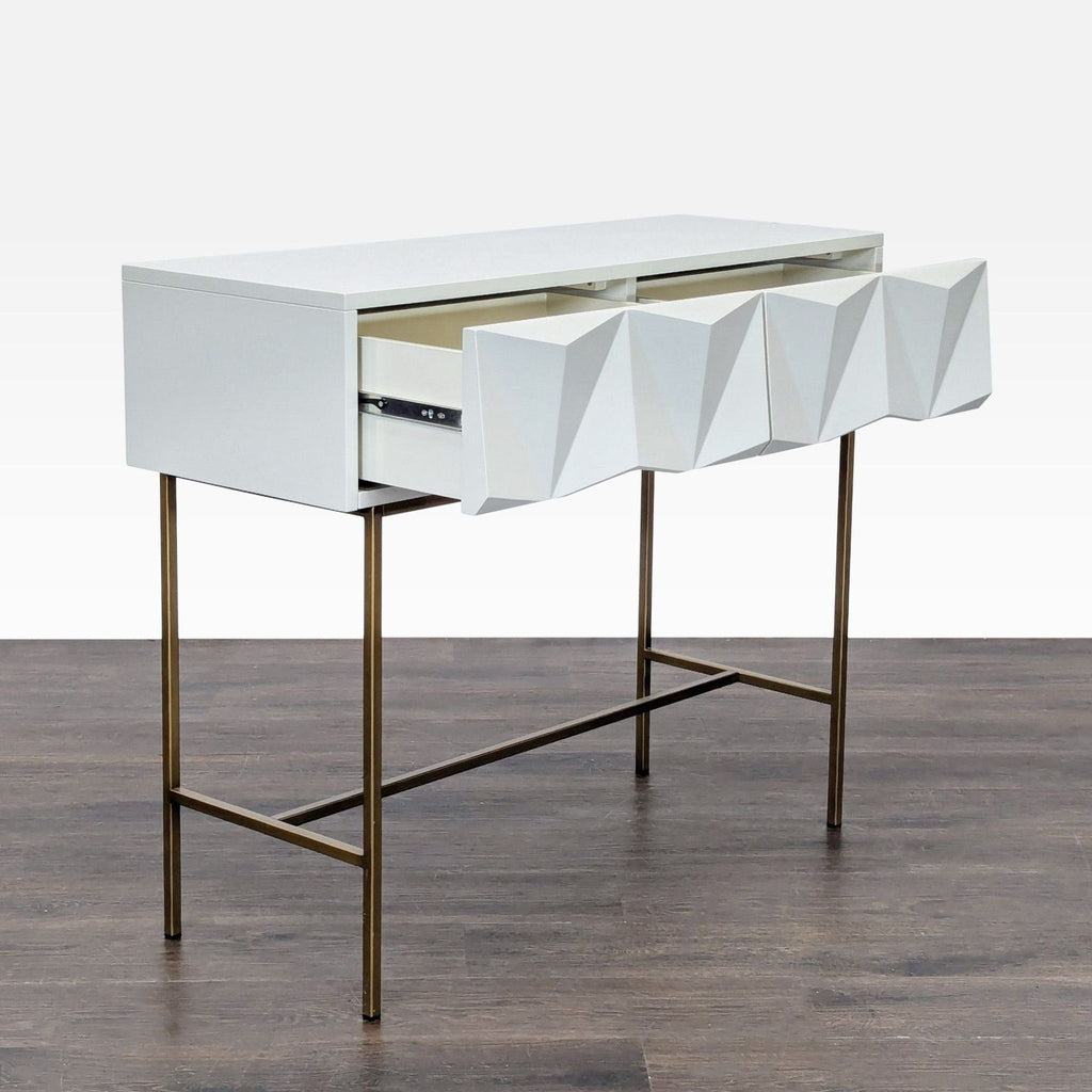 West Elm console table featuring sleek metal drawer fronts and vintage-style brass legs, contemporary design.