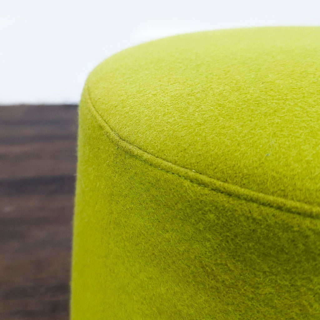 Modern ottoman from Hightower with a friction leather bottom, ideal for flexible seating arrangements.
