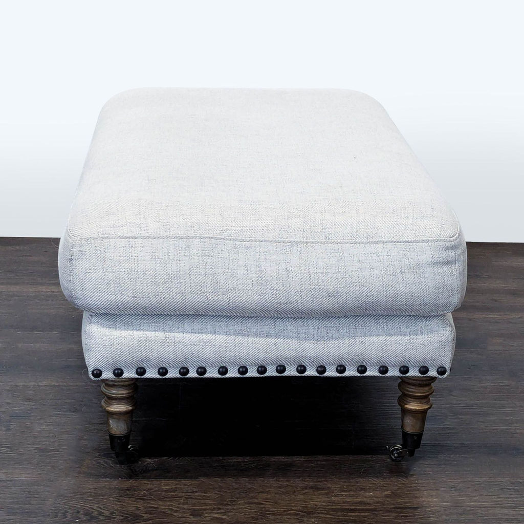 3. Plush ottoman from Stools, Ottomans & Benches, highlighted by its pillow top and turned feet.