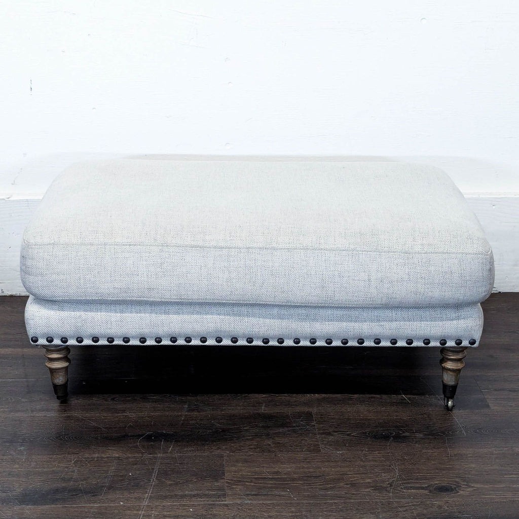 Upholstered Ottoman with Nailhead Trim