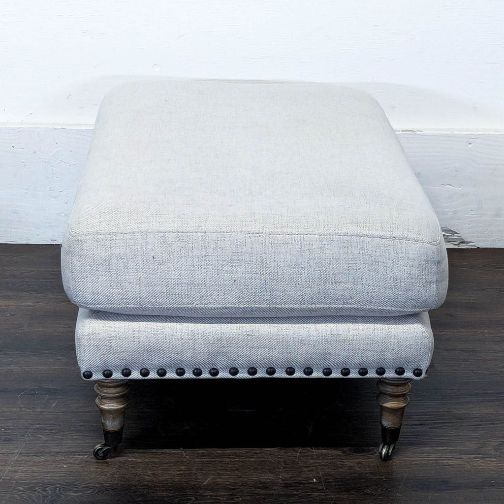 Upholstered Ottoman with Nailhead Trim