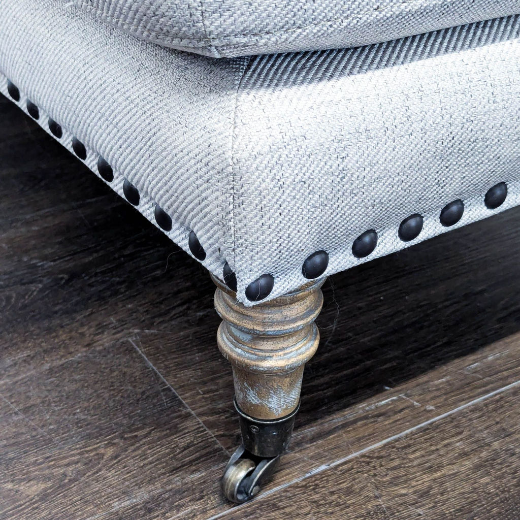 Upholstered Ottoman with Nailhead Trim