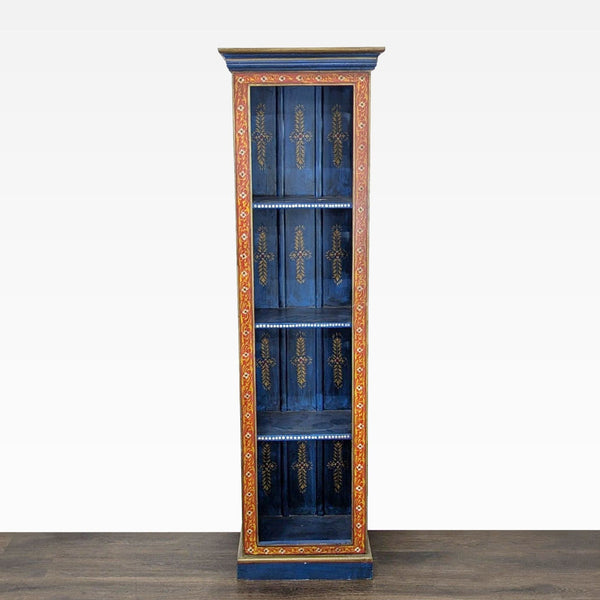 1. Tall blue World Market bookshelf with hand-painted gold accents and four shelves, framed by a colorful border.