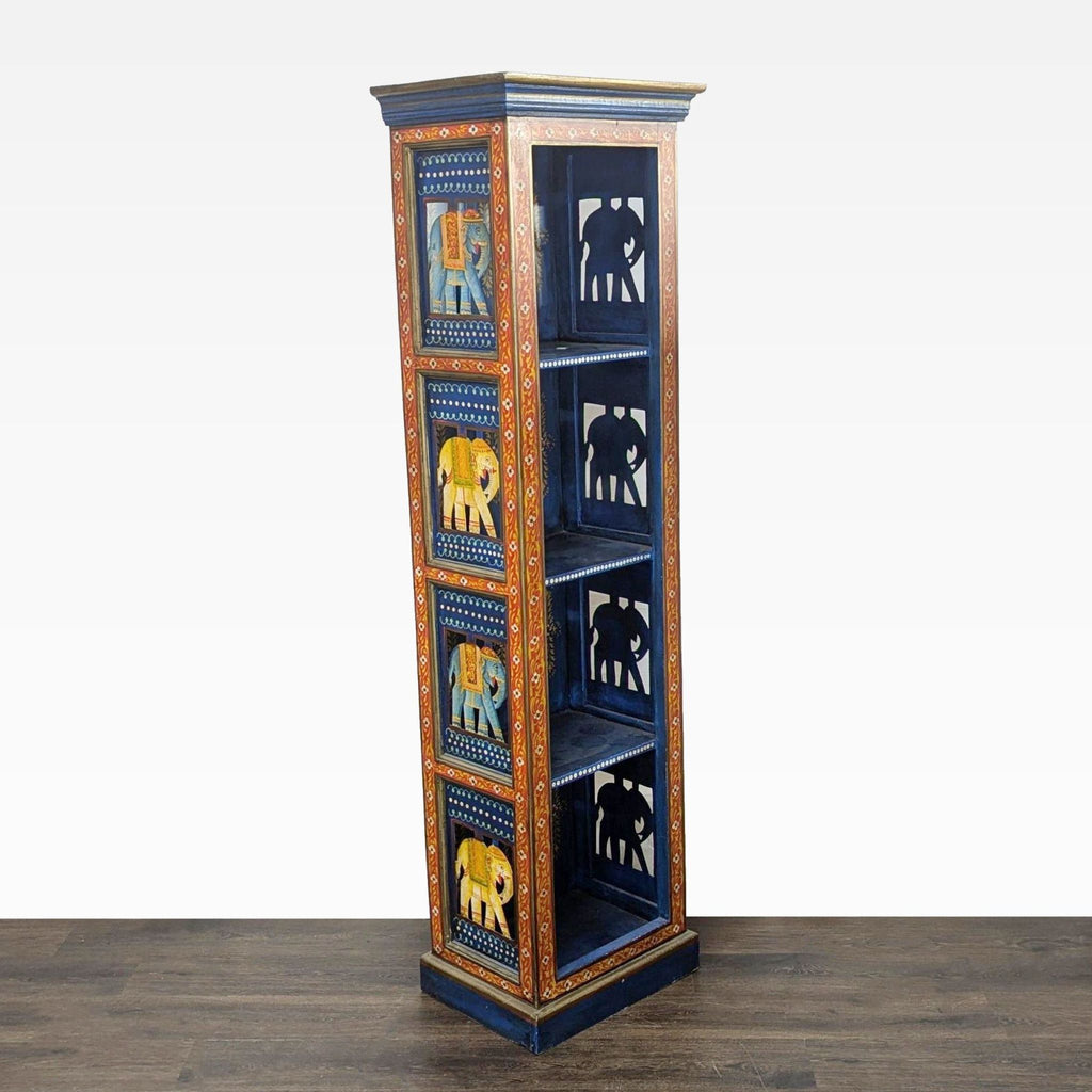 2. Side view of a narrow blue bookshelf, featuring colorful carved elephant designs and gold details on each shelf.