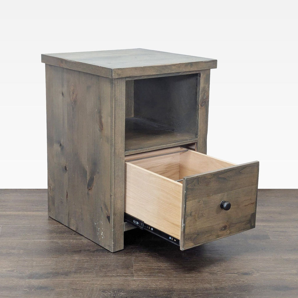 Legends Furniture wooden cabinet features a drawer, open shelf, and built-in hole for organized cable management.