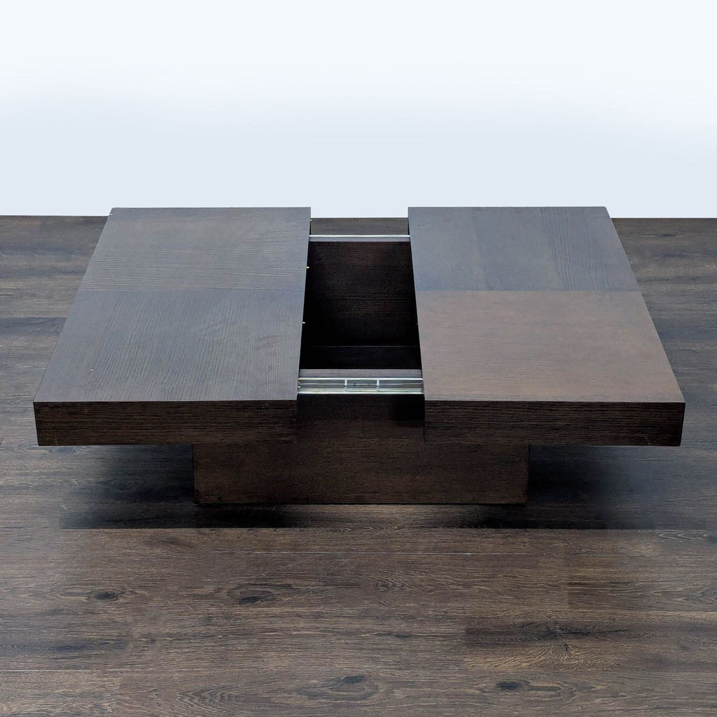 2. Modern coffee table with dark wood top, revealing a sliding storage compartment at the center.  