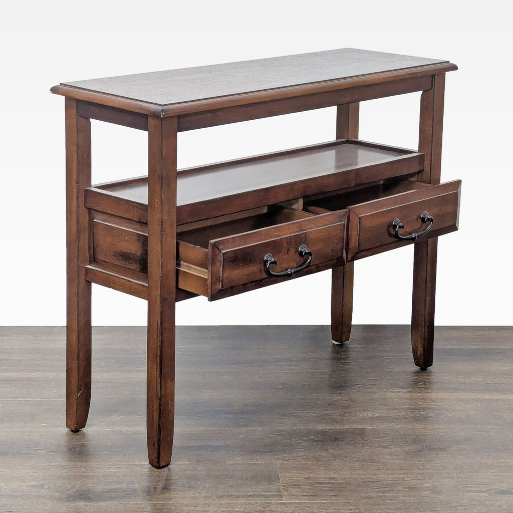 2. Angled view of a Pier 1 Imports console table showing two open drawers and a lower shelf.