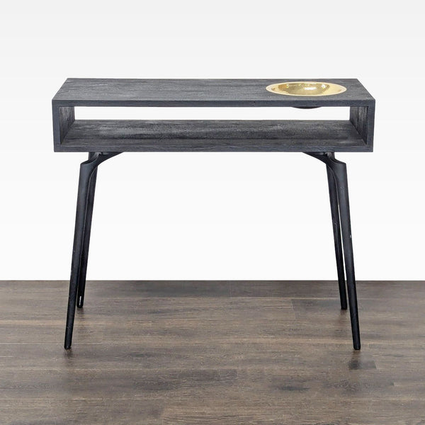 Rectangular console table with a dark wood top, open shelf, and inset brass bowl, designed by Ayush Kasliwal.