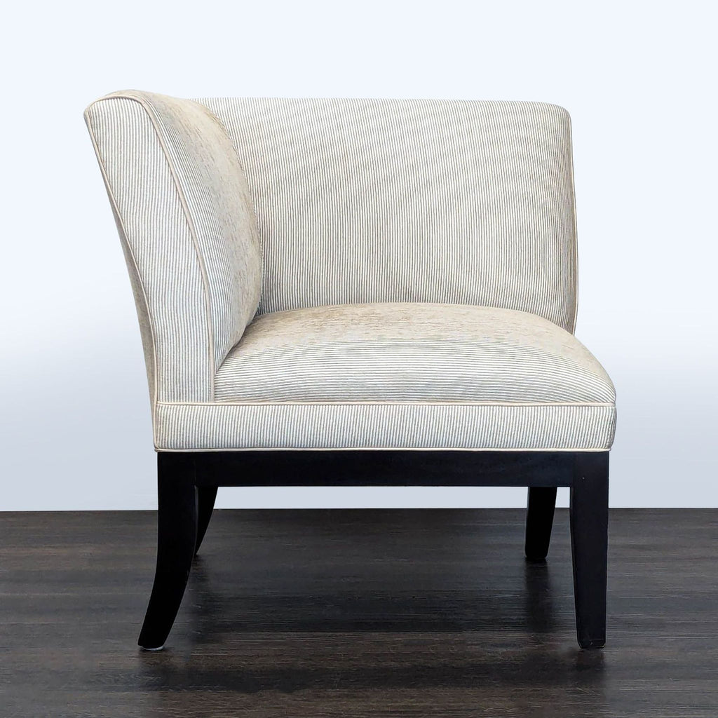 Corner lounge chair with light striped fabric and dark wood legs, designed for cozy seating or reading nooks.  