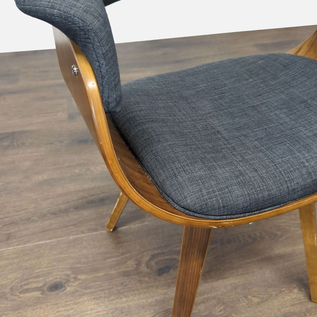 Mid-century modern Armen Living dining chair with cushioned bucket seat and walnut-colored wooden legs.