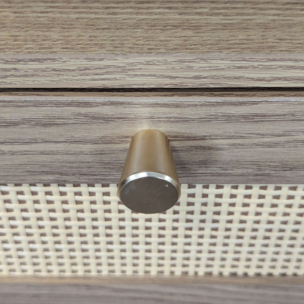 Wooden end table with a single rattan-insert drawer and an open shelf for storage or display.
