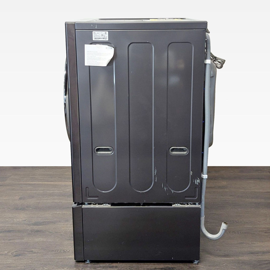 Space-saving LG washer/dryer combo featuring a stylish finish, large drum, and convenient lower pedestal.