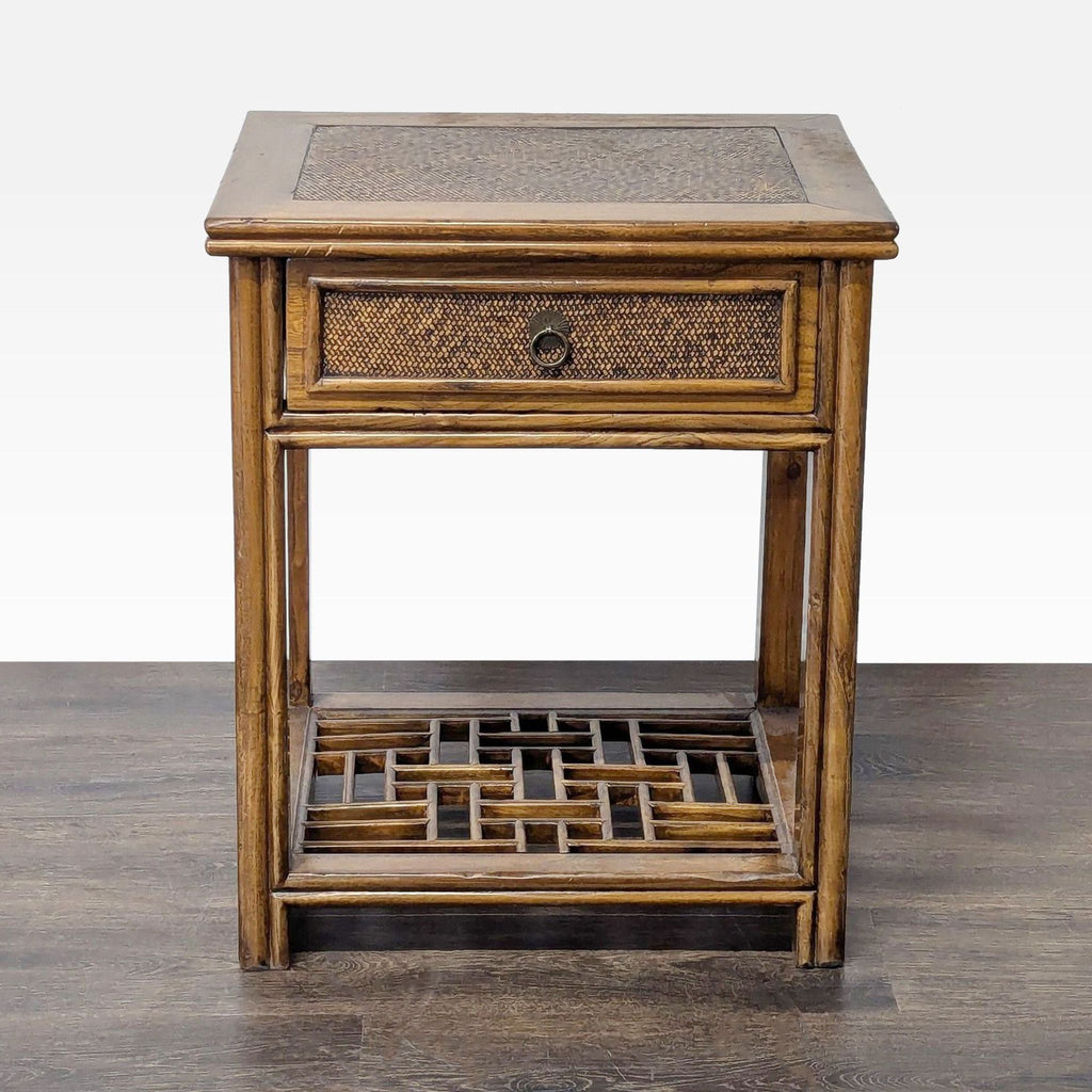 Bamboo end table with woven rattan surfaces and single drawer, featuring a lattice shelf below.