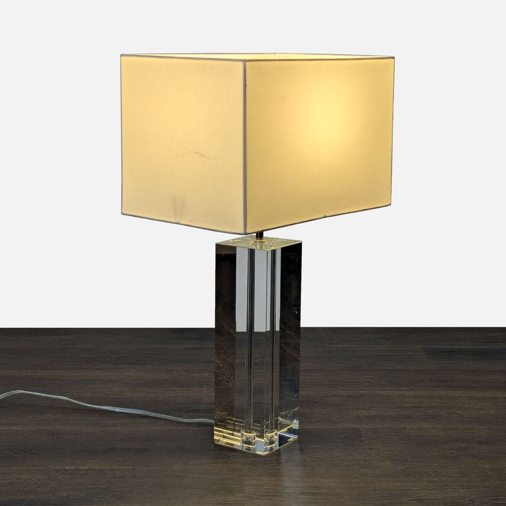 Modern crystal-based Room & Board lamp with square fabric shade, suitable for desks or nightstands.