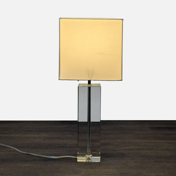 Room & Board table lamp with a clear crystal base and square fabric shade, modern and minimalistic style.
