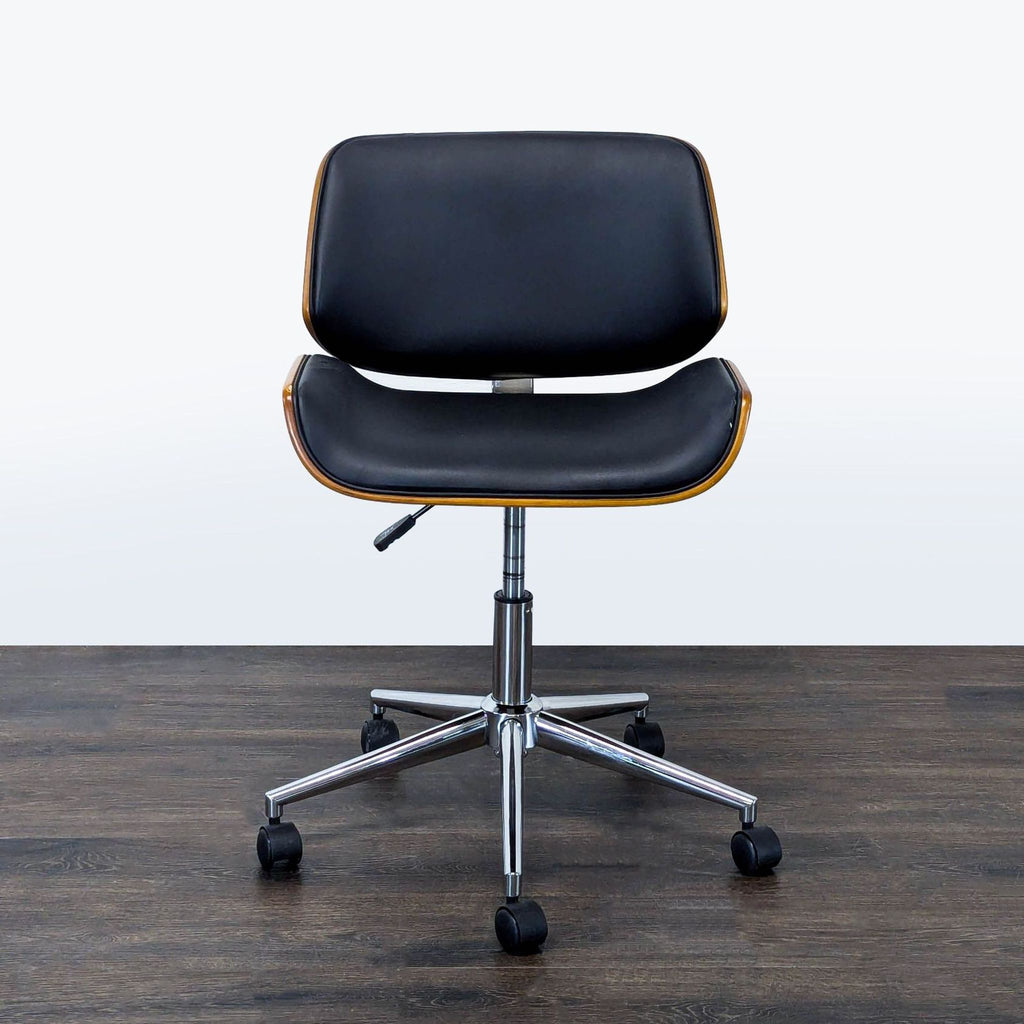 Black cushioned office chair with wood trim, chrome wheeled base, and ergonomic adjustable design.