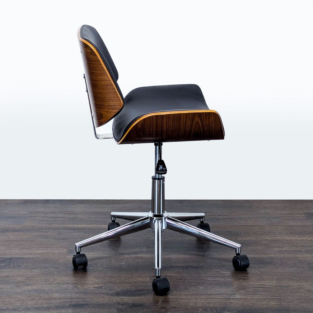 Stylish chair for home office featuring black upholstery, elegant wood details, and a sleek chrome base.