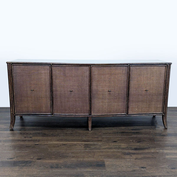 Large oak cabinet with woven raffia doors, rattan borders, and bowed front by McGuire/Baker, dark tobacco finish.  