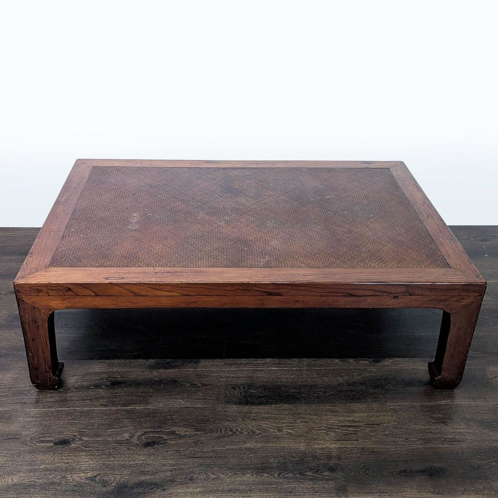 2. Top-down view of a rectangular wooden coffee table featuring a woven rattan surface and sturdy frame.