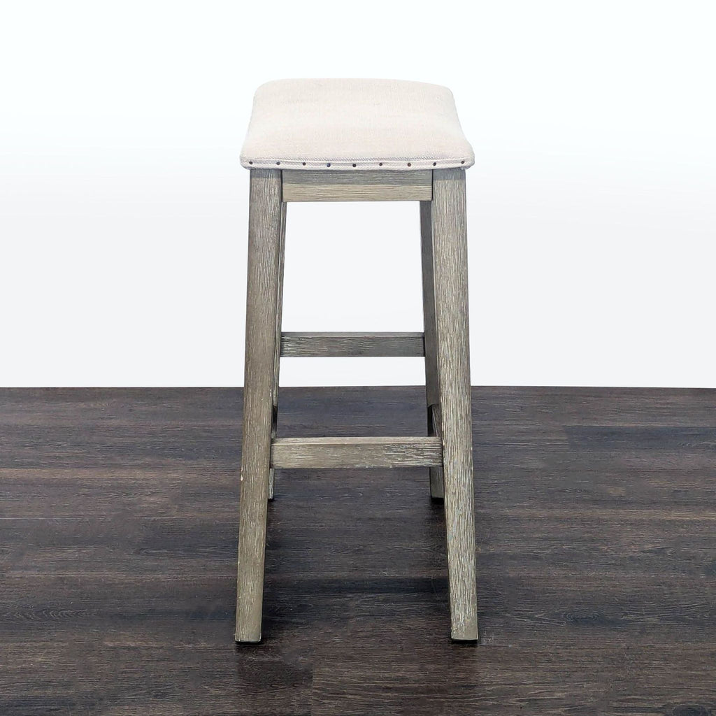 Elegant upholstered stool by Pottery Barn featuring nailhead trim, perfect for stool, ottoman, or bench use.