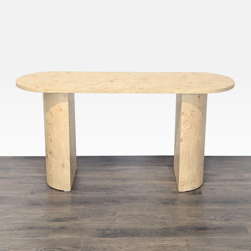 Oval console table with a burl wood pattern finish, designed for side or entryway use.