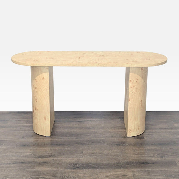 Oval console table with a burl wood pattern finish, designed for side or entryway use.