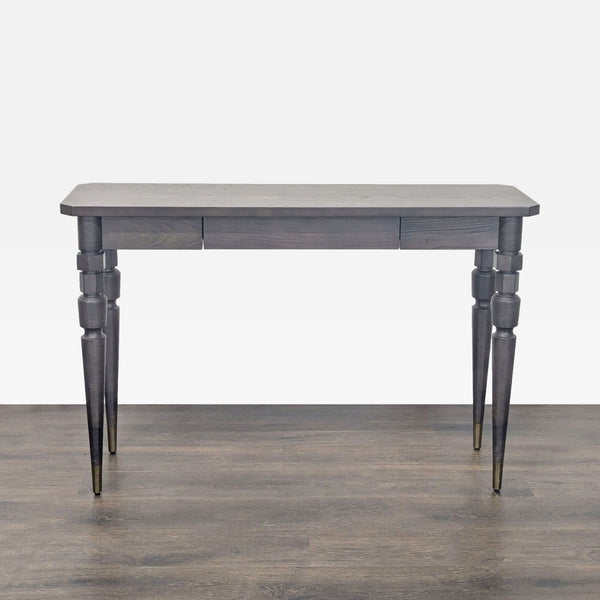 1. West Elm dark wood console table with decorative turned legs, shown on a wood floor with neutral background.