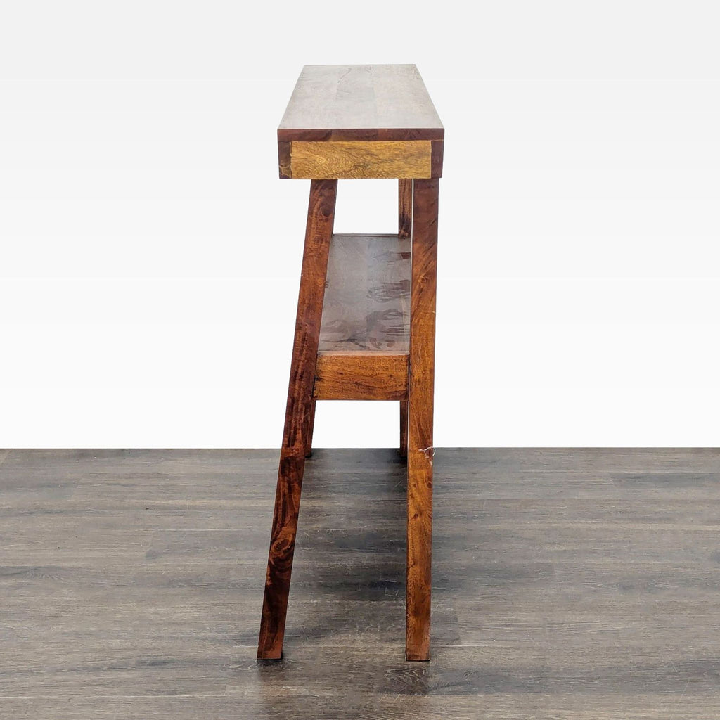 2. Side view of a narrow wooden side table featuring angled legs and a second lower shelf.