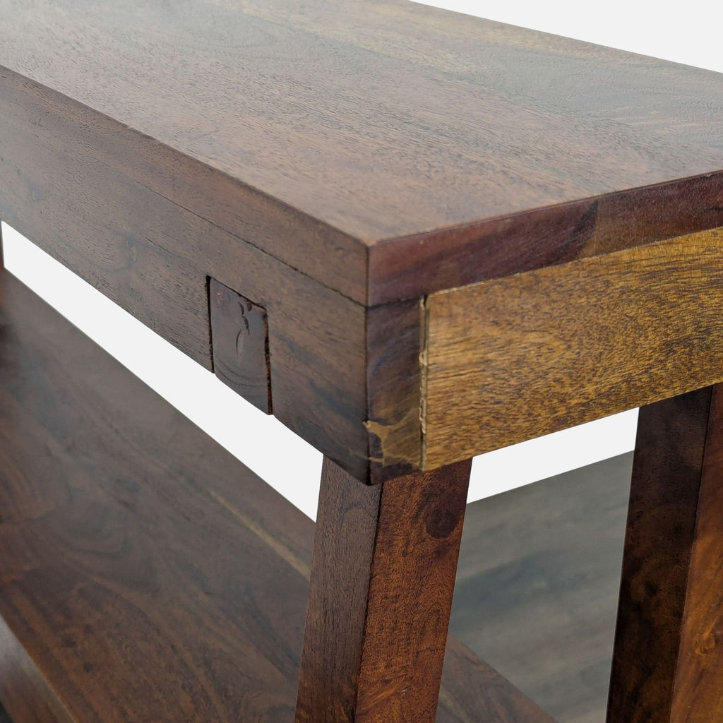 3. Close-up of the corner and joint details on a solid wood console table with natural grain.