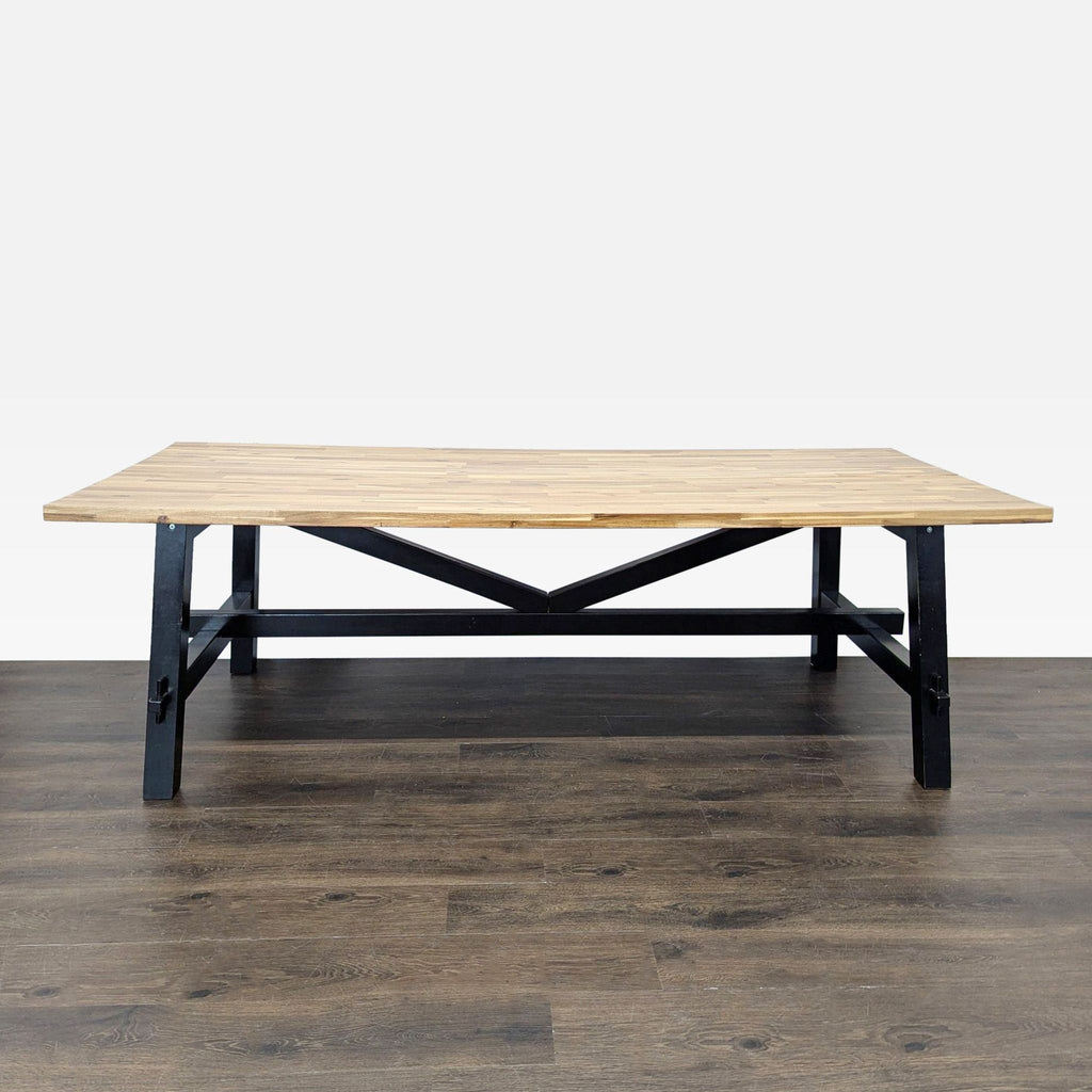 2. Sleek Ikea dining table with a minimalist design, comfortably seats six people in a bright dining room.