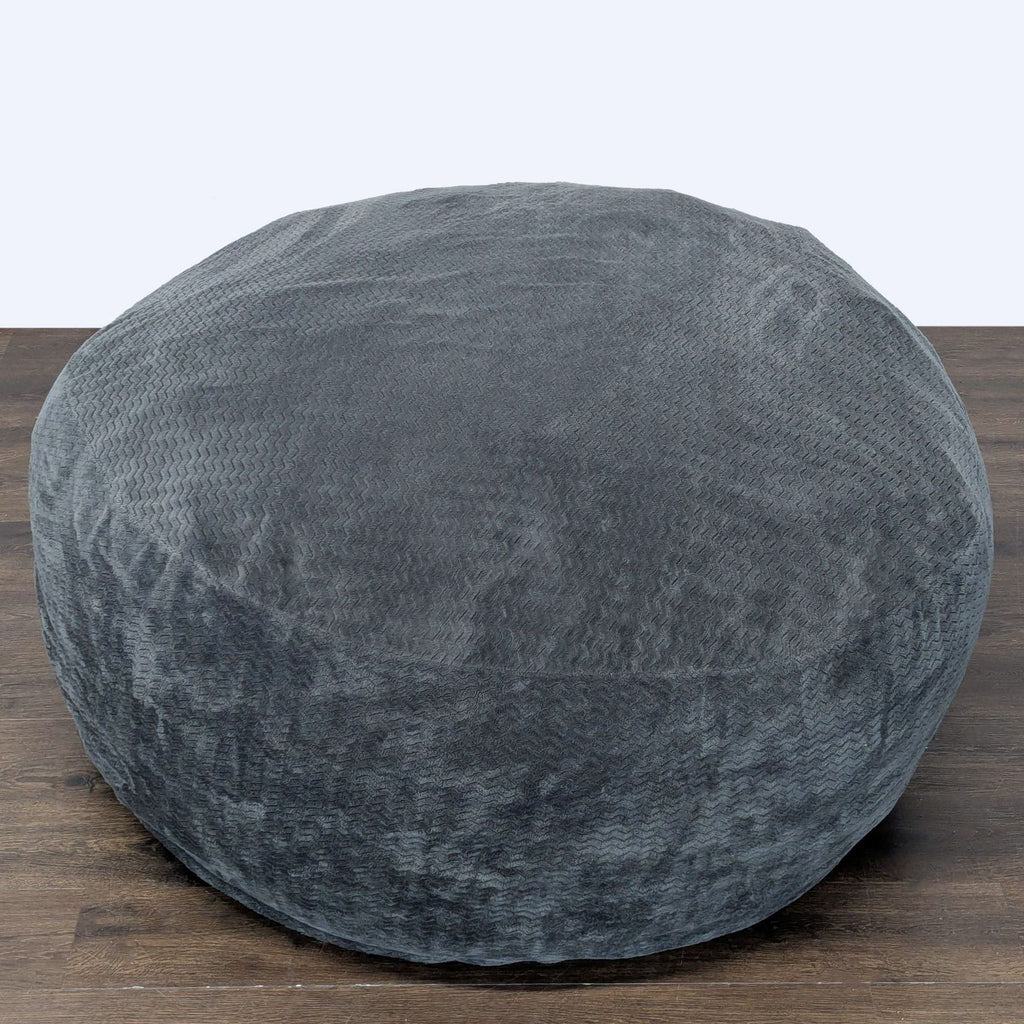 1. Cozy Lounge & Co. bean bag chair in soft gray fabric with a round shape, ideal for relaxing in any room.