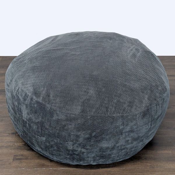1. Cozy Lounge & Co. bean bag chair in soft gray fabric with a round shape, ideal for relaxing in any room.