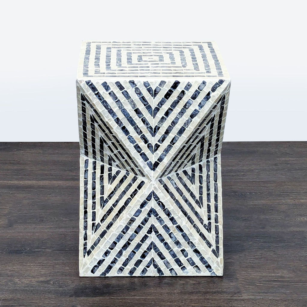 Geometric side table by Lacquer World with black and white mosaic pattern forming bold angular designs.  