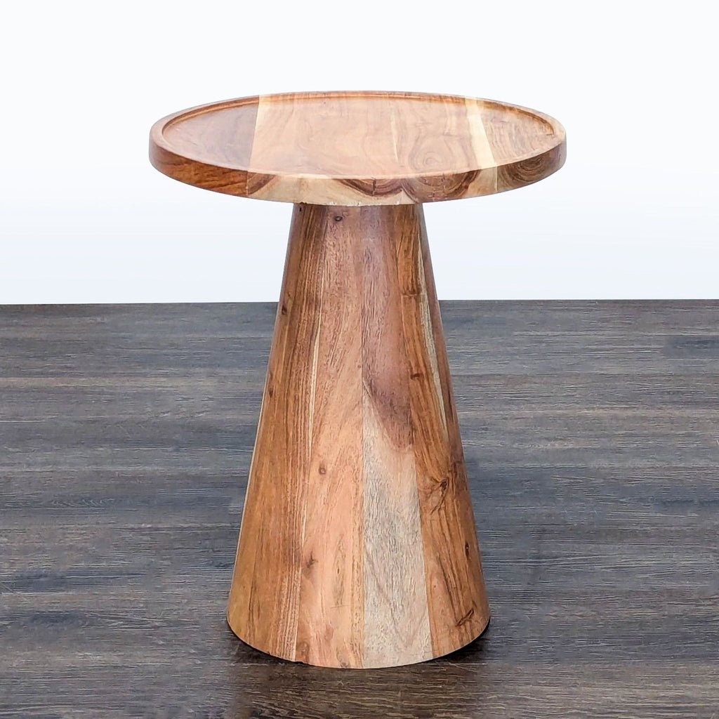 2. Modern round wooden side table with flared cylindrical base and smooth finish, viewed from an angle.