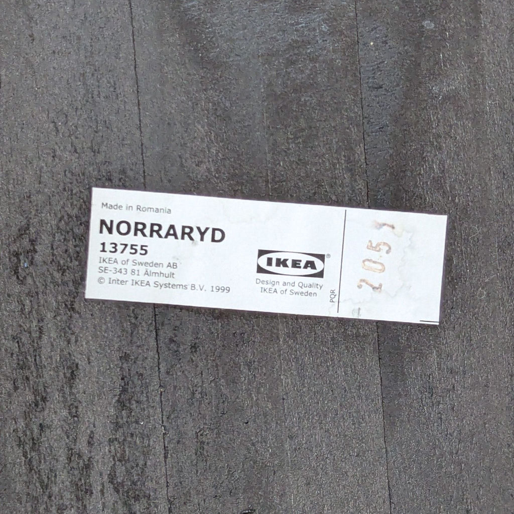 IKEA NORRARYD dining chair label showing model details and "Made in Romania" text.