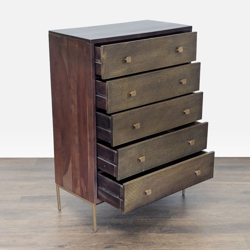Modern dark wood West Elm dresser featuring unique brass-patterned drawer fronts and five spacious storage compartments.