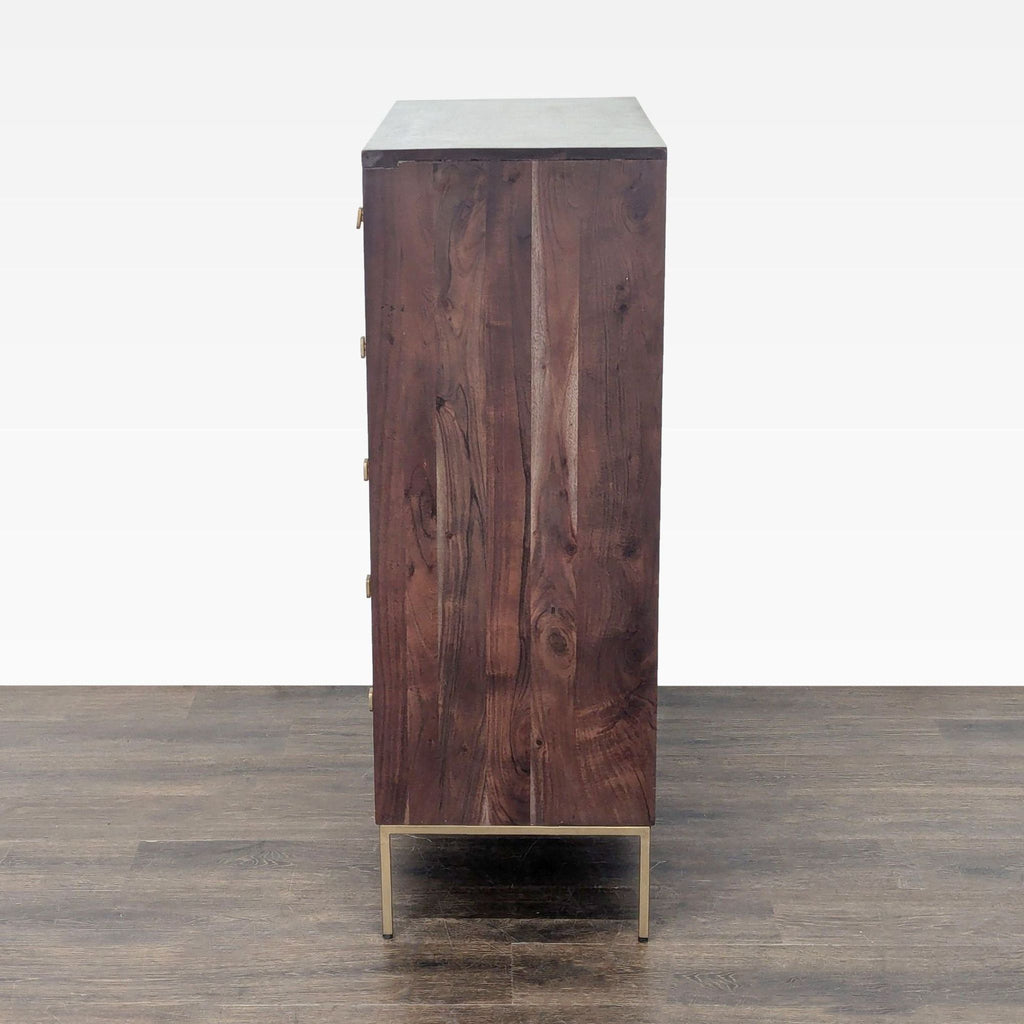 Five-drawer West Elm dresser with sturdy metal legs and eye-catching brass details, ideal for clothes or accessories.