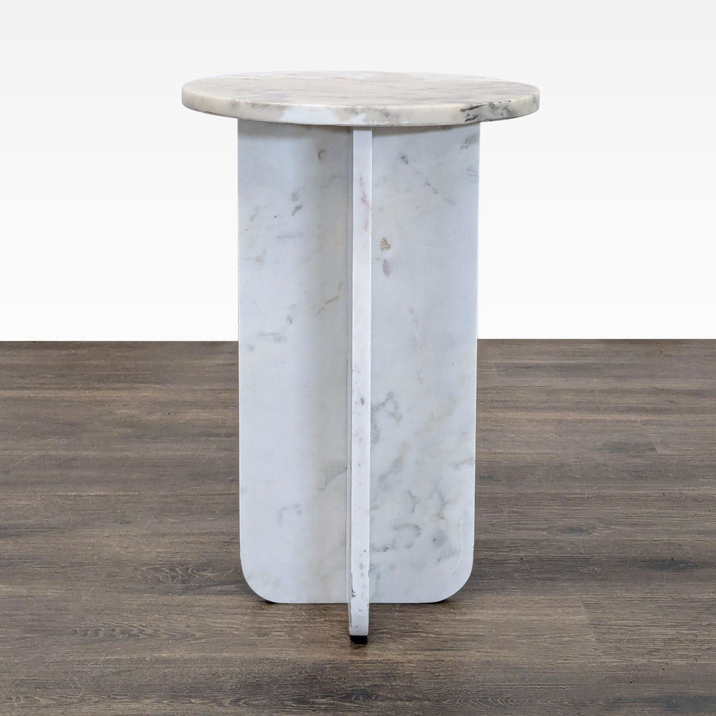 1. Round white marble side table with a cross-panel base, shown on a wood floor, category: Side & Console Table.  