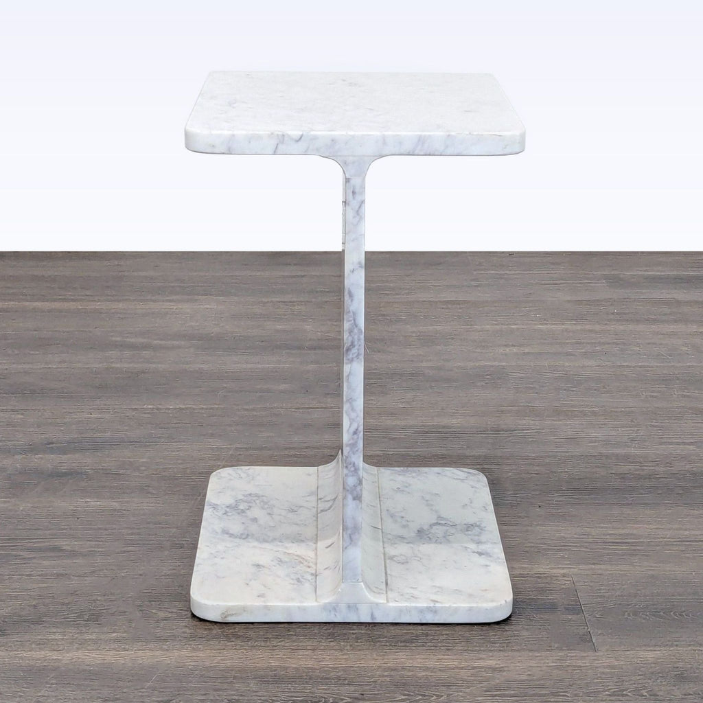 2. Console table by Nadaal featuring a distinctive I-beam shape carved from solid marble.  